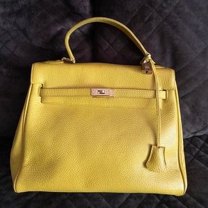 “Kelly” bag. Yellow leather. Brand new